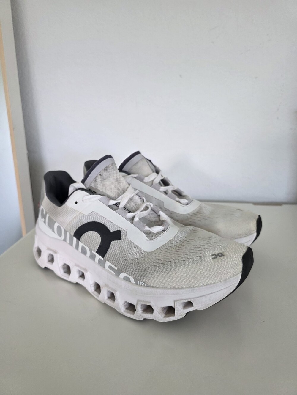 On Cloudmonster running white and black